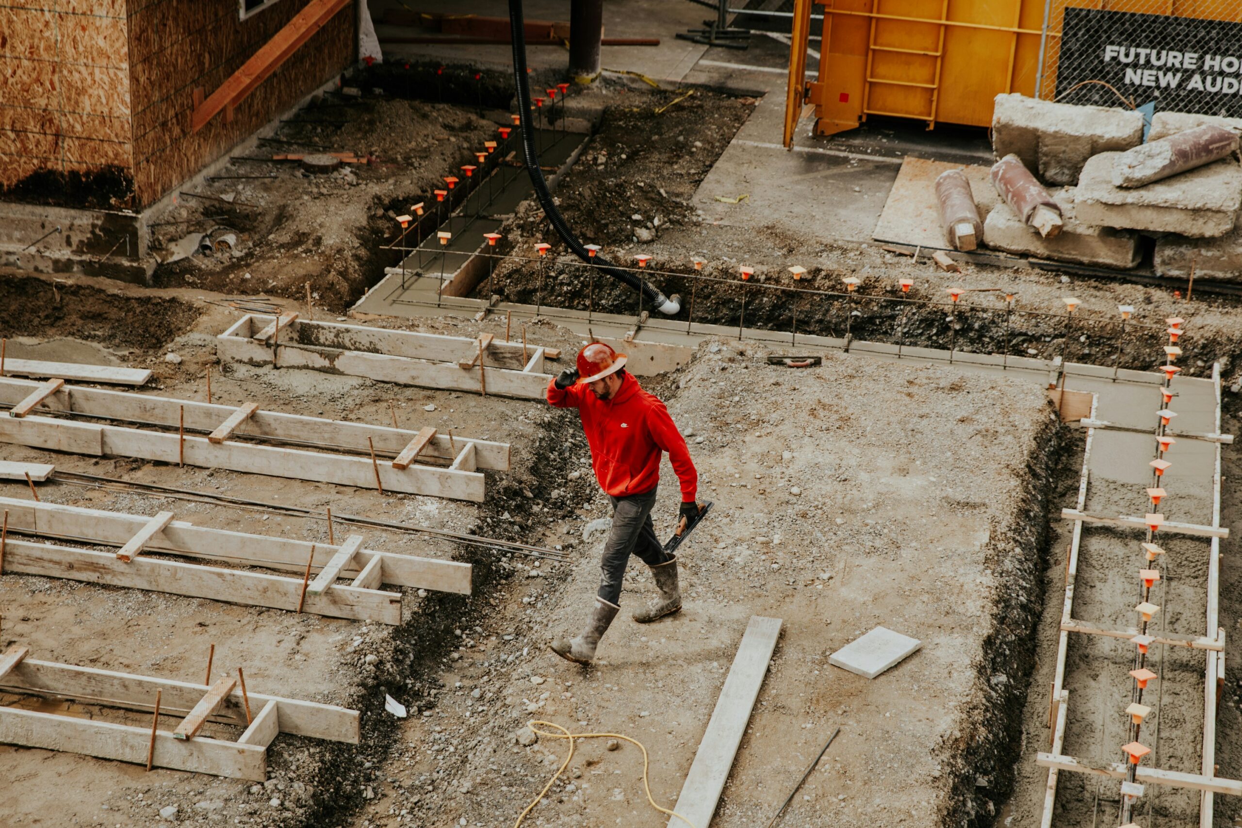 Professional concrete contractor at an active construction site.